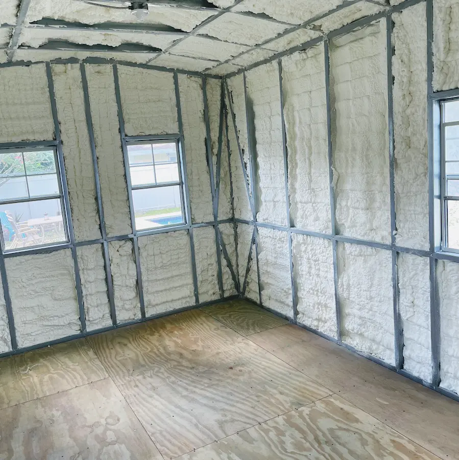Closed-cell spray foam insulation applied to wall cavities in a residential project in Vandalia